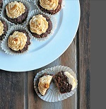 Dark chocolate cupcakes with peanut and cream cheese frosting 